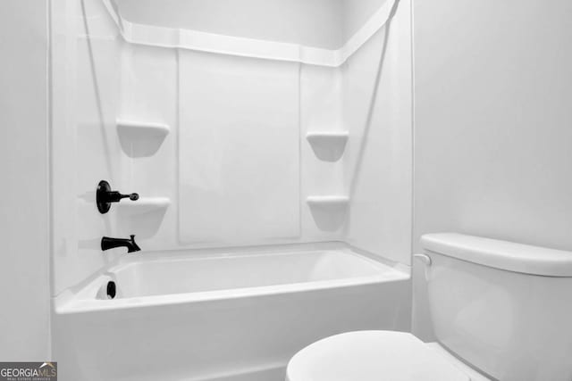 bathroom with toilet and shower / bathing tub combination