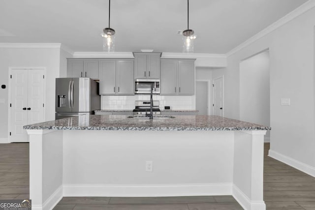 kitchen featuring pendant lighting, gray cabinetry, and stainless steel appliances