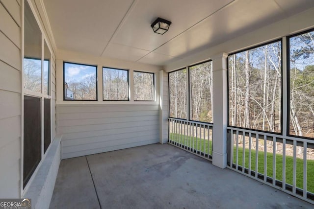 unfurnished sunroom with a wealth of natural light