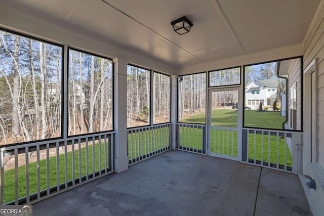 unfurnished sunroom with a healthy amount of sunlight