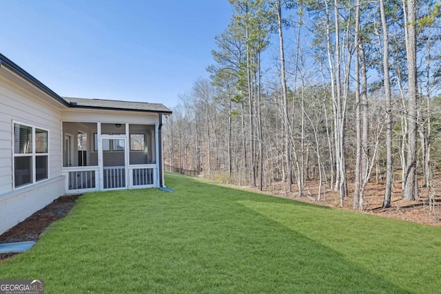 view of yard featuring a sunroom