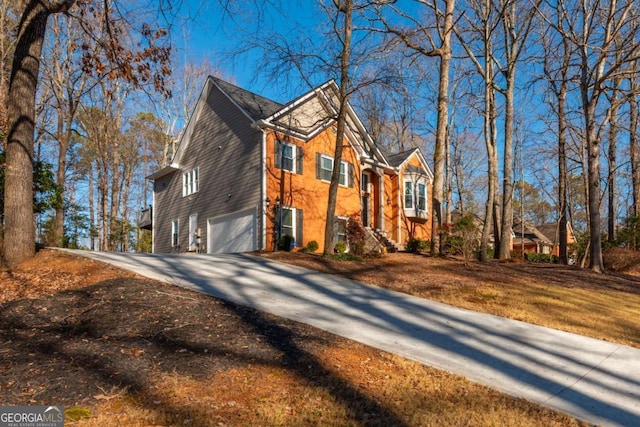 view of side of home with a garage