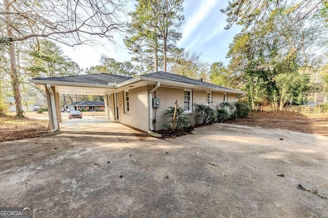 view of property exterior with a carport