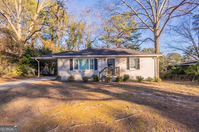 ranch-style house with a carport