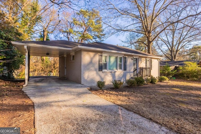 view of front of property featuring a carport