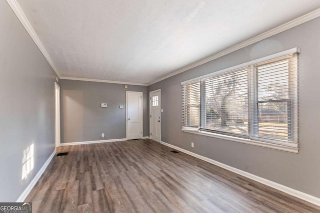 entryway featuring ornamental molding and dark wood-type flooring