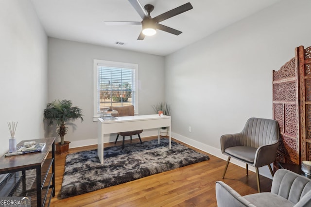 office featuring hardwood / wood-style flooring and ceiling fan