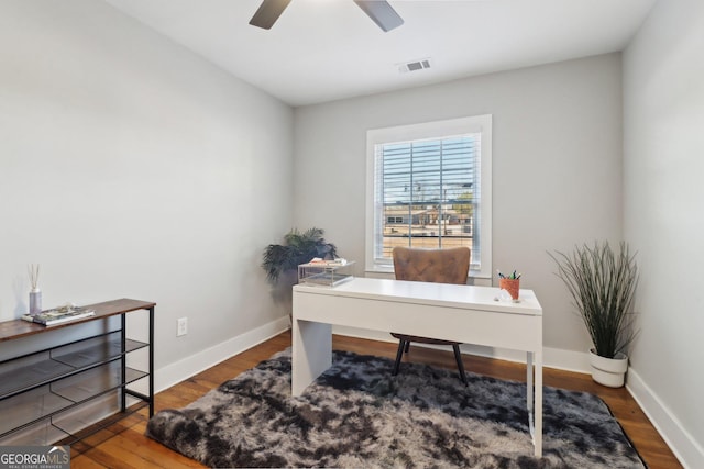 home office featuring hardwood / wood-style flooring and ceiling fan