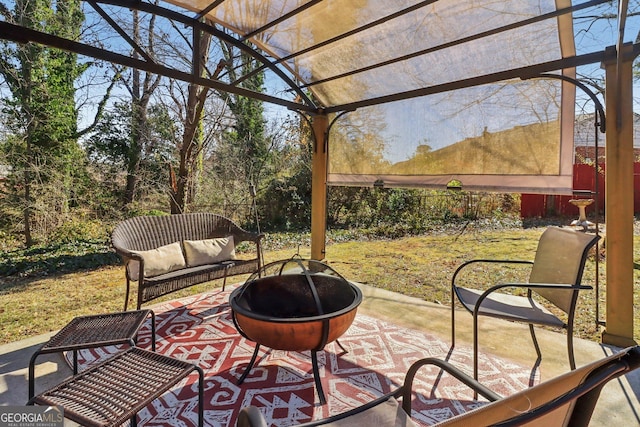 view of patio / terrace featuring an outdoor fire pit