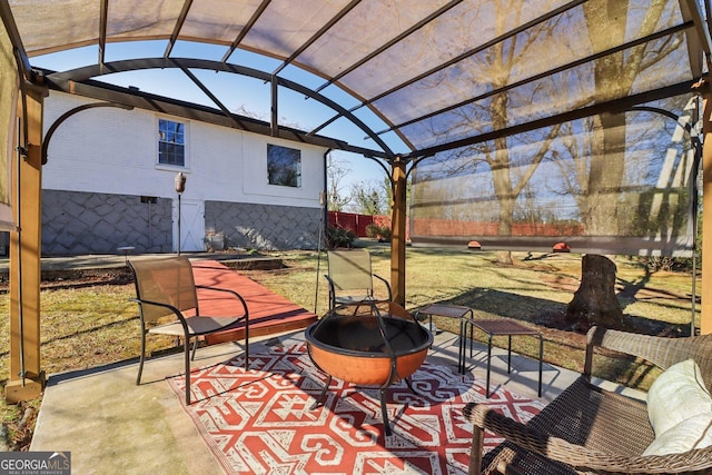 view of patio with an outdoor fire pit