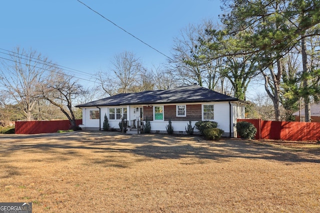 ranch-style house with a front lawn