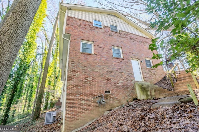 view of home's exterior featuring central air condition unit