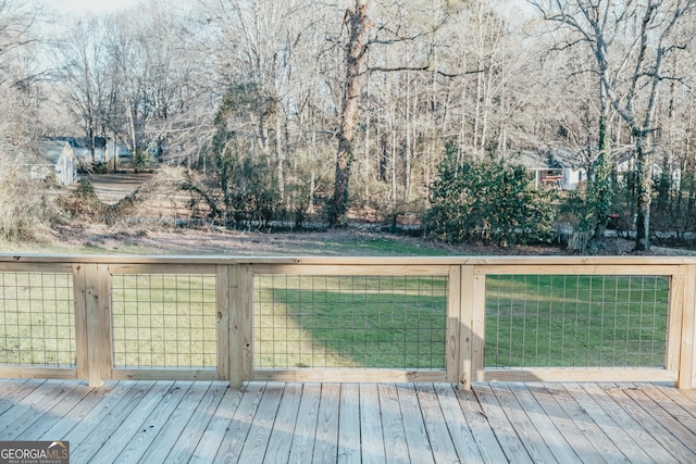 wooden deck with a yard