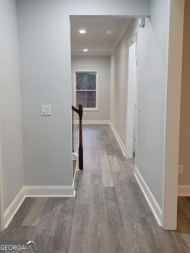 hall with crown molding and dark hardwood / wood-style floors