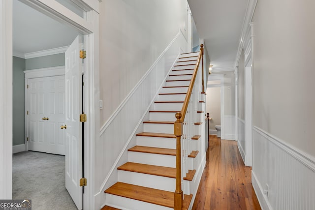 staircase with ornamental molding