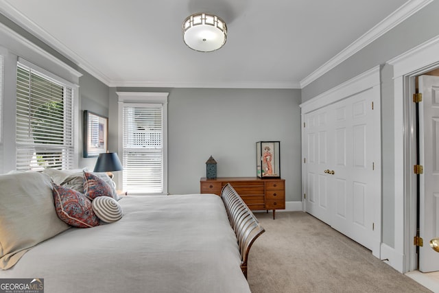 carpeted bedroom with ornamental molding