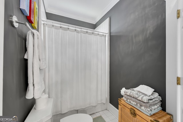 bathroom featuring shower / tub combo with curtain, crown molding, tile patterned floors, and toilet