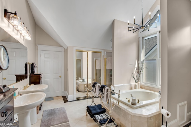 bathroom with a relaxing tiled tub, tile patterned flooring, a chandelier, and vaulted ceiling