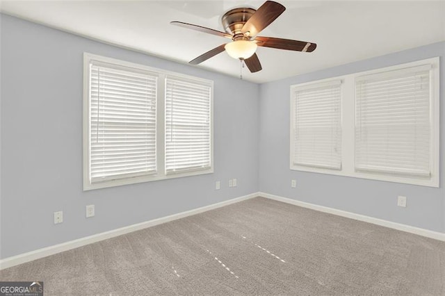 spare room with carpet flooring and ceiling fan