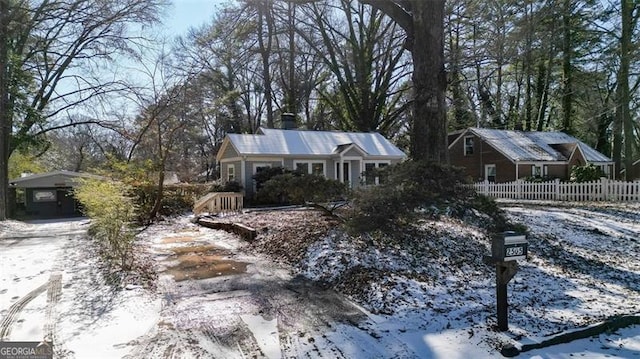 view of front of property featuring a carport