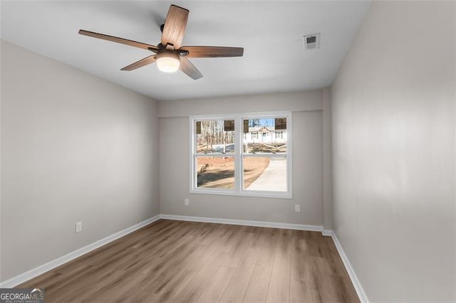 spare room featuring ceiling fan and wood-type flooring