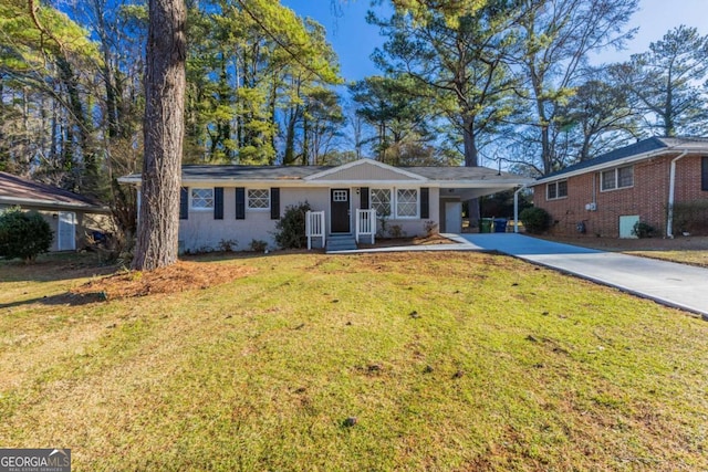 ranch-style home featuring a front yard and a carport