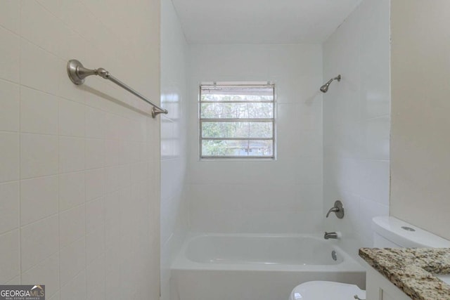 full bathroom featuring vanity, toilet, and tiled shower / bath combo