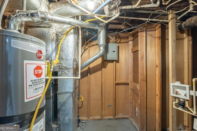 utility room featuring electric panel and gas water heater