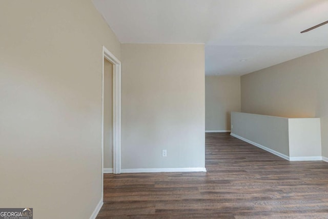 spare room featuring dark hardwood / wood-style floors and ceiling fan