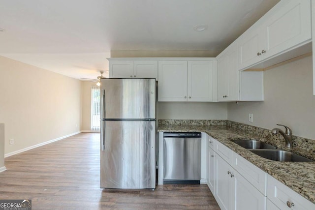 kitchen featuring sink, white cabinetry, and appliances with stainless steel finishes