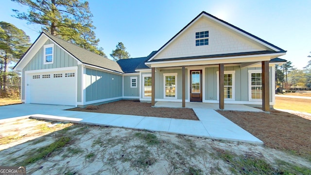 view of front of home with a garage and covered porch