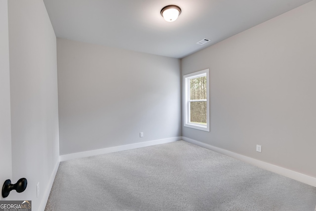 empty room featuring carpet floors