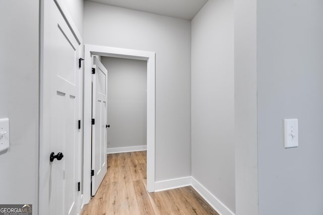 corridor featuring light hardwood / wood-style floors