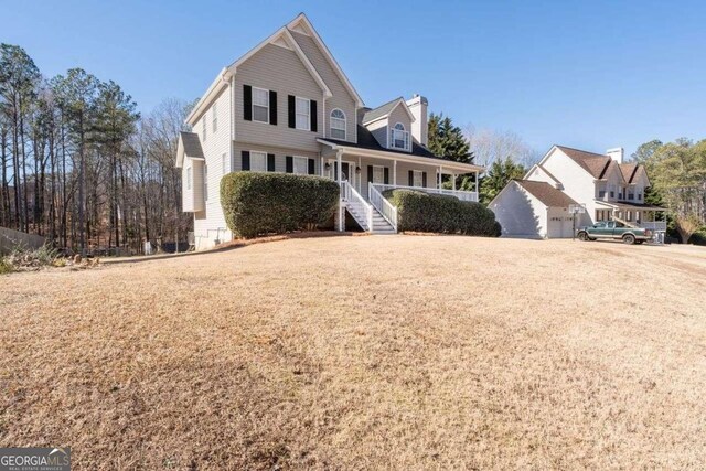 view of front property with a garage and covered porch