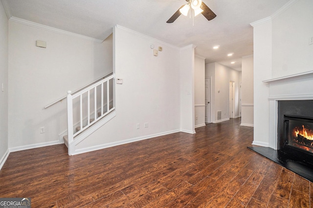 unfurnished living room featuring ornamental molding, dark hardwood / wood-style floors, and ceiling fan