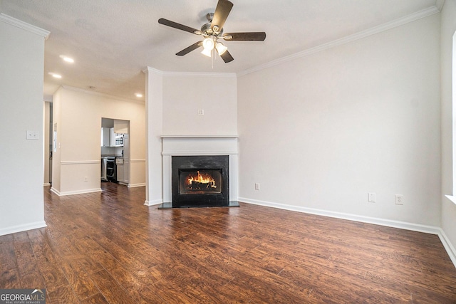 unfurnished living room with dark wood-type flooring, ceiling fan, and crown molding