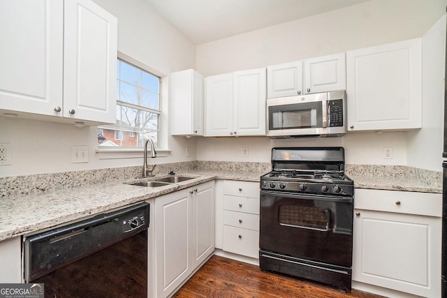 kitchen featuring sink, white cabinets, and black appliances