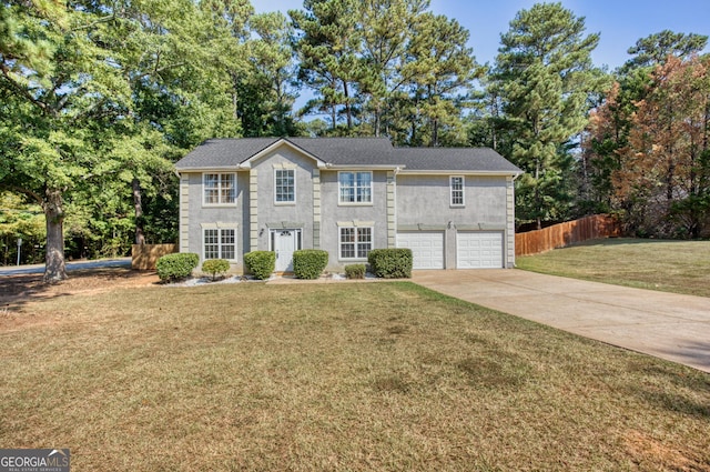 view of front of property featuring a garage and a front yard