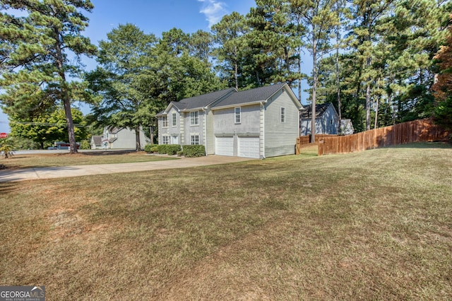 exterior space with a garage and a front yard