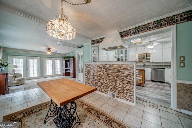 3170 Ebenezer Rd, Marietta, GA 30066 - dining space featuring ceiling fan, ornamental molding, a textured ceiling, light tile patterned floors, and a chandelier