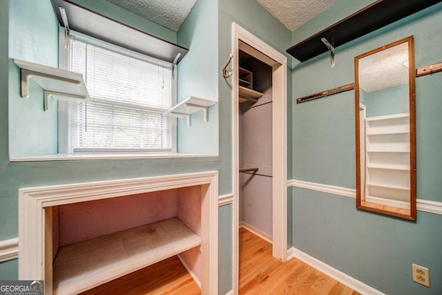 spacious closet with light wood-type flooring