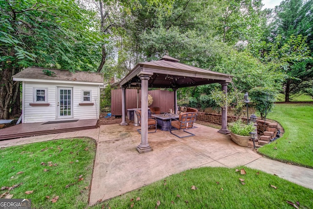 view of patio / terrace with an outbuilding and a gazebo