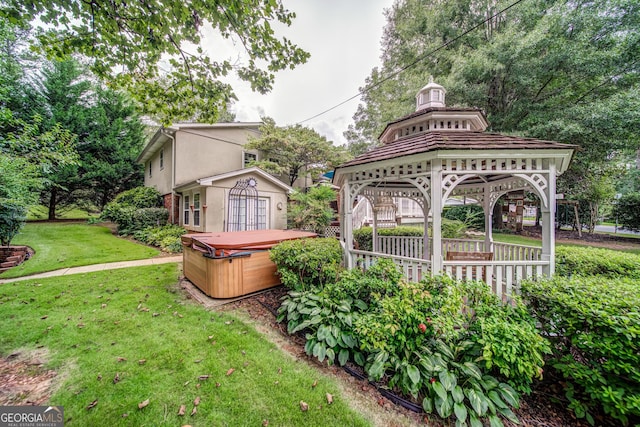 view of yard with a gazebo and a hot tub