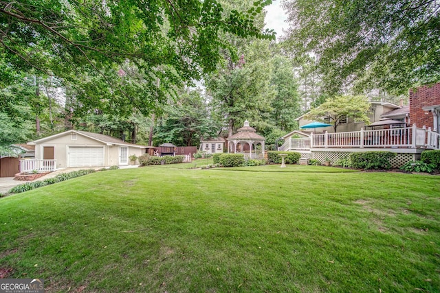 3170 Ebenezer Rd, Marietta, GA 30066 - view of green lawn featuring a gazebo, an outbuilding, a deck, and view of wooded area