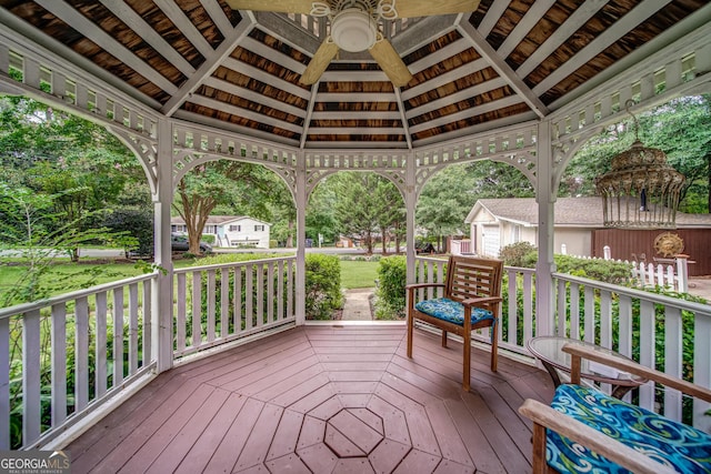 wooden terrace featuring a gazebo