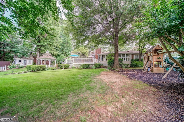 view of yard with a gazebo and a playground