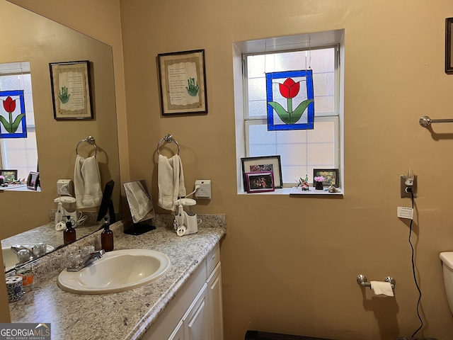 bathroom with vanity and toilet