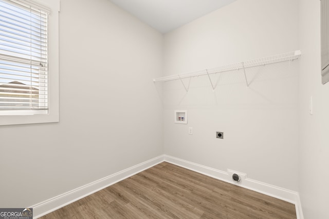 laundry area with hardwood / wood-style flooring, washer hookup, and hookup for an electric dryer