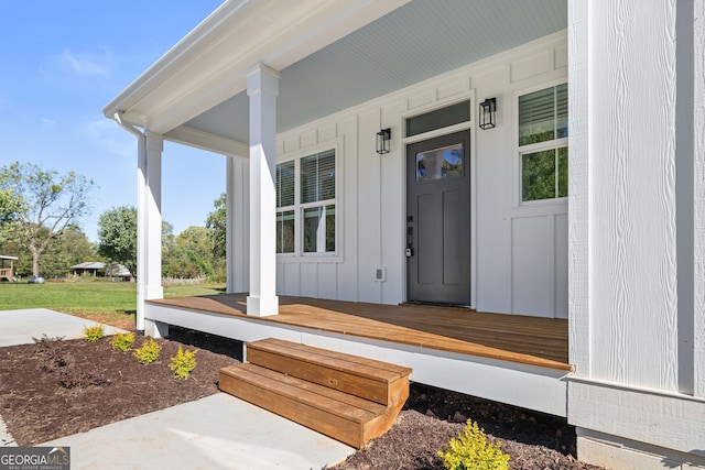 view of exterior entry featuring a porch