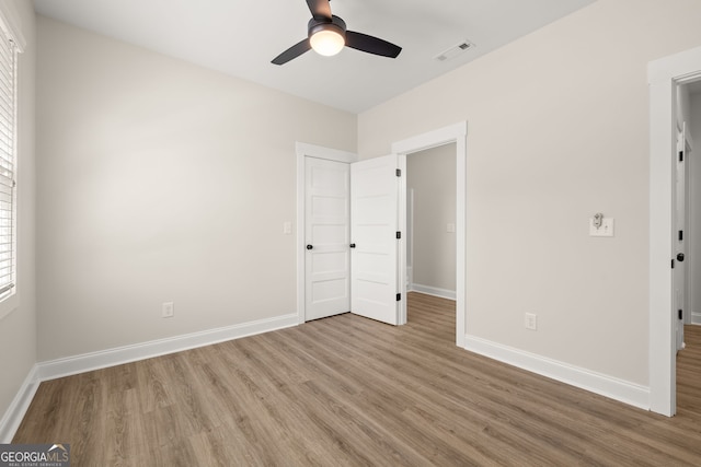 unfurnished bedroom featuring light hardwood / wood-style floors and ceiling fan